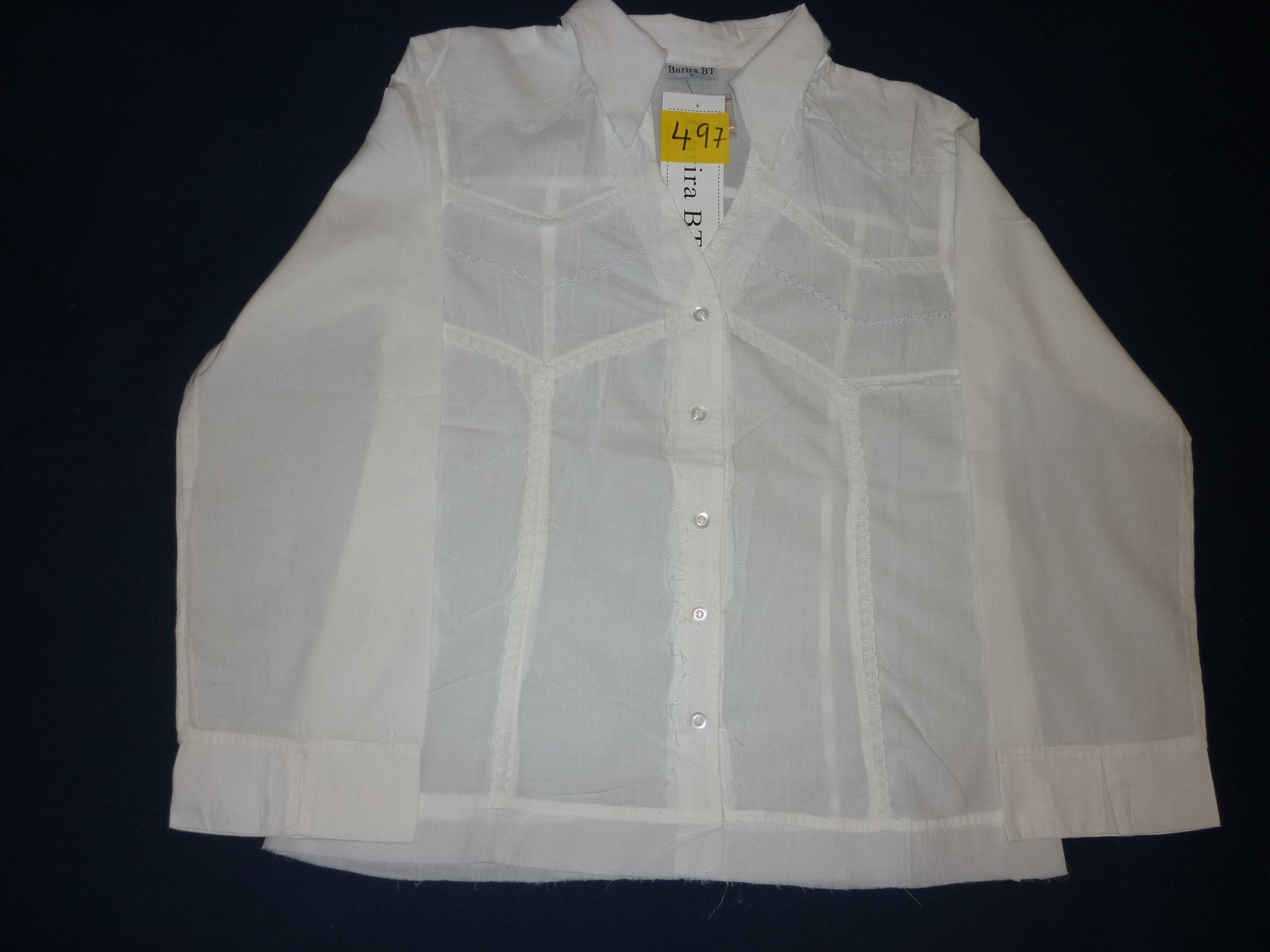 INDIAN BLOUSE IN EXCLUSIVE DESIGN,100% COTTON FOR WEARING IN CHRISTMAS AND PARTIES . WHITE, STYLISH TYPE V COLLAR , STYLISH EMBROIDERY ,HAVING 5 BUTTONS FOR FRONT OPENING AND LONG SLEEVES. NO BUTTONS AT THE CUFFS.WE ALSO GUARANTEE THAT YOU CAN NOT FIND AN